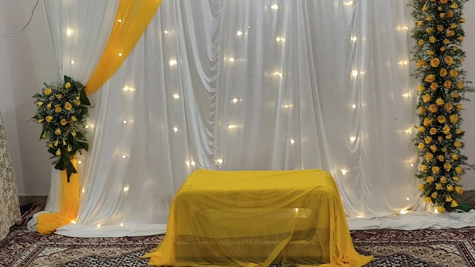 Marigold and gold haldi stage setup in a Bangalore home